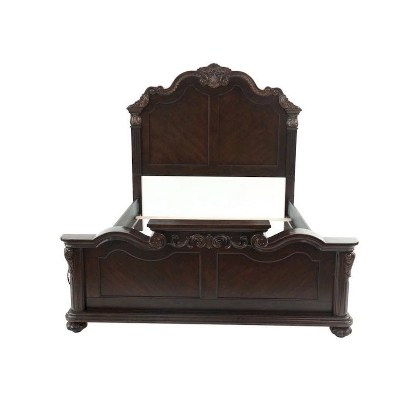 Lit queen en bois finement sculpté, finition noyer foncé et placage